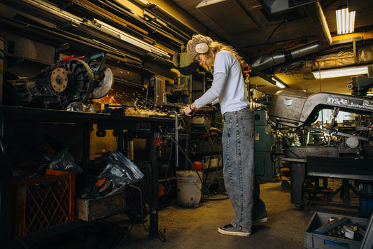 Lucy in the workshop in jeans