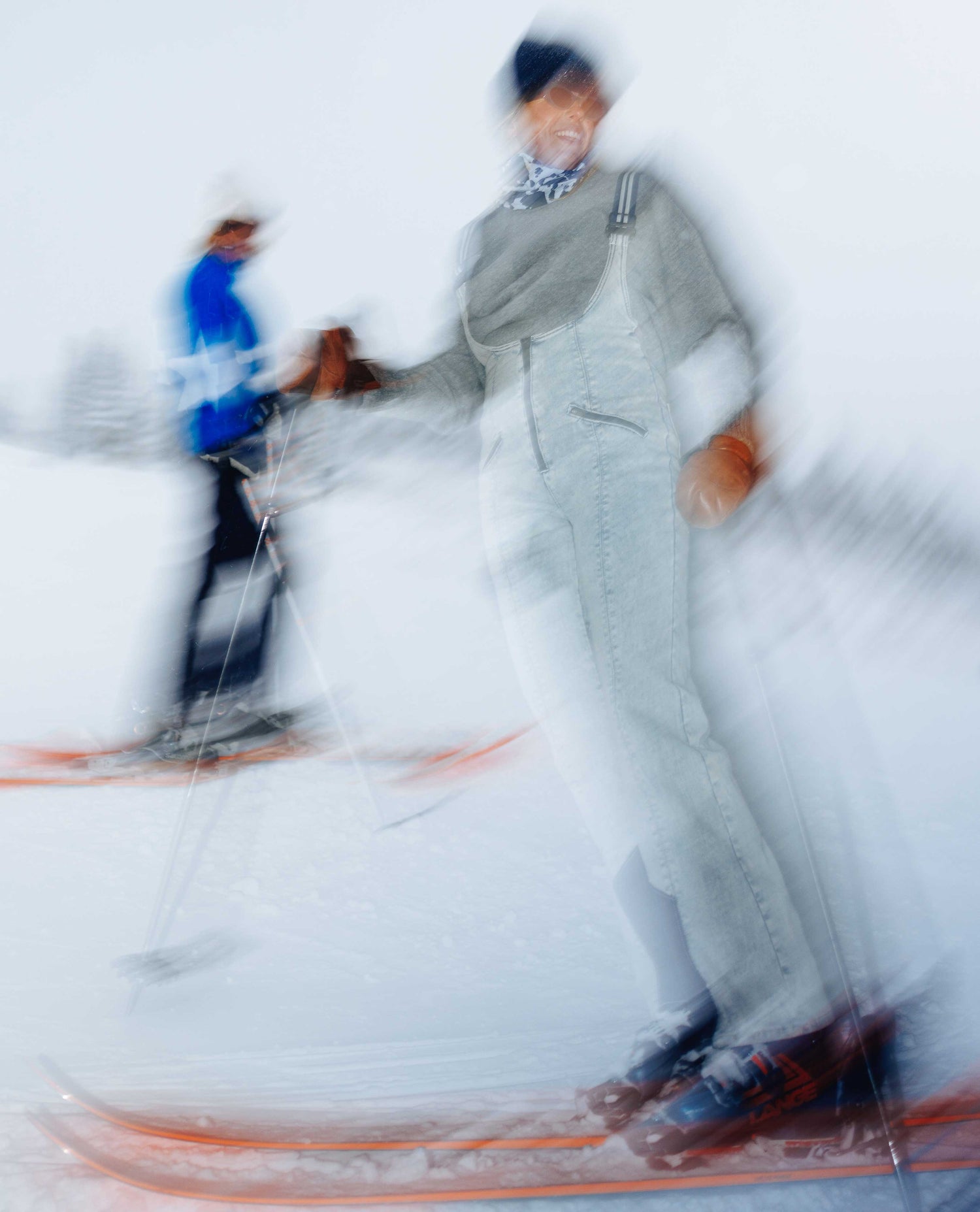 Two skiers on a snowy slope with blurred motion effect