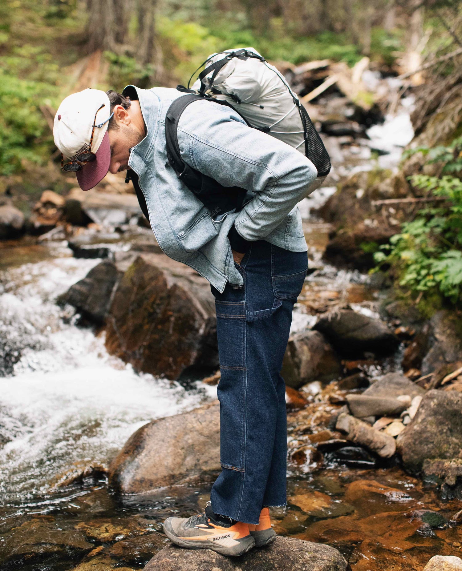 Guy standing by a river in GT Reverso jacket