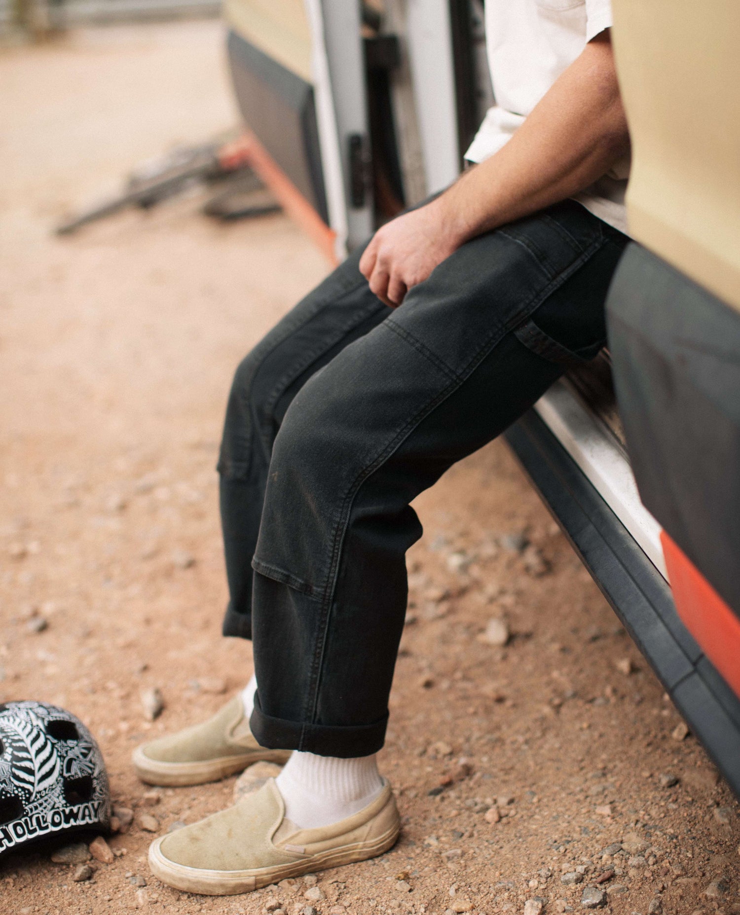 Black utility pants on callum sitting on the van