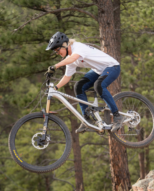 Hitting a jump in Women's Denim Bike Pant 
