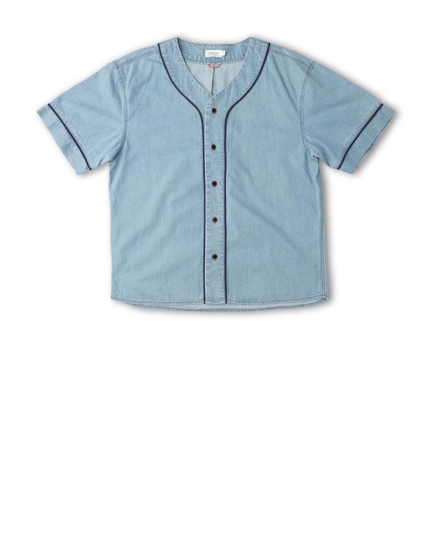 A light blue denim short-sleeve button-up shirt with dark contrast piping along the collar, sleeve cuffs, and front button placket, displayed flat against a white background.