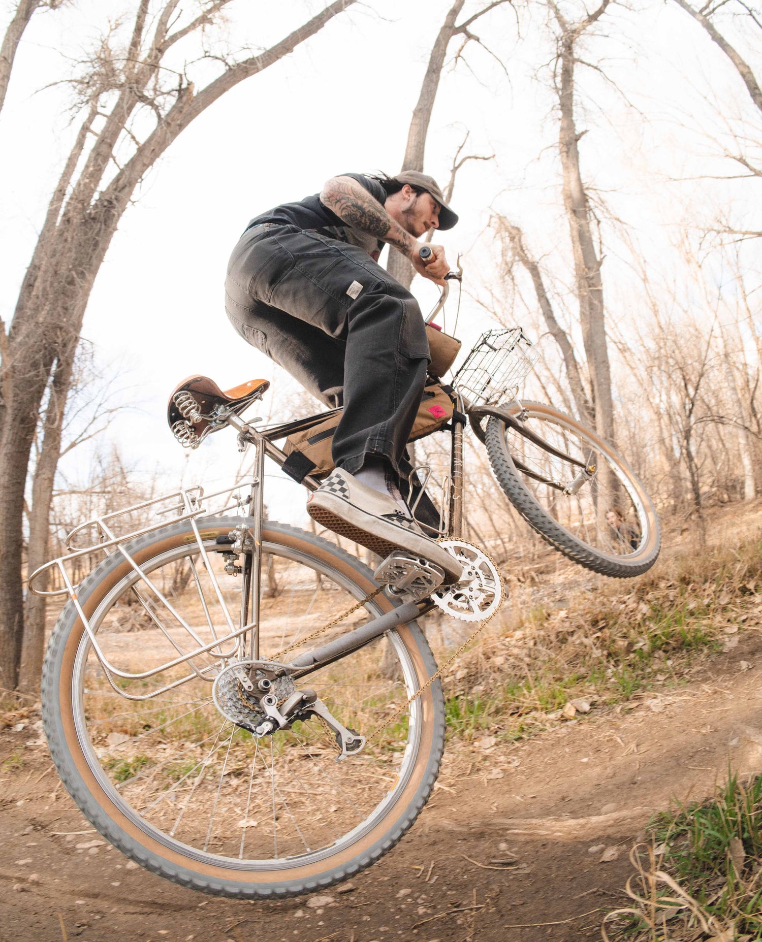 Max hitting a jump on his cool vintage bike