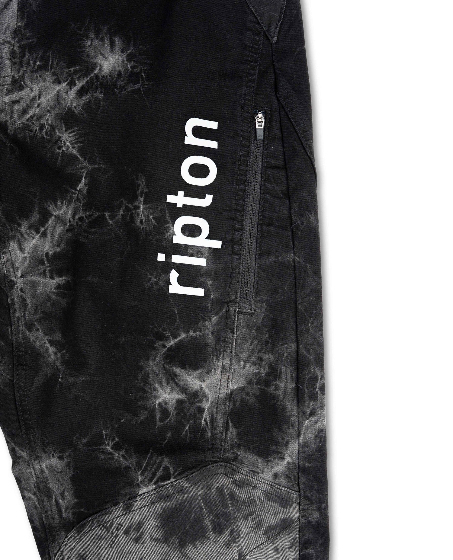Black tie-dye pants with 'ripton' branding on a white background