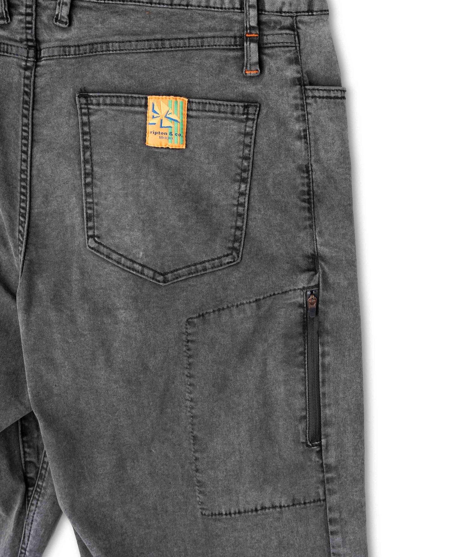 Gray pants with a brand logo on the pocket against a white background