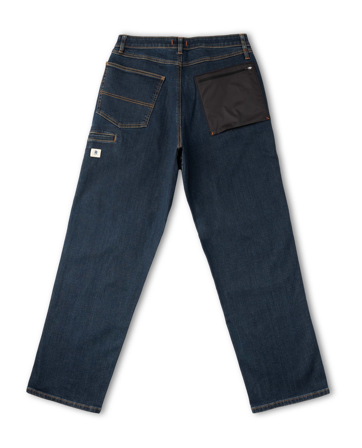 Dark blue jeans with a brown patch on a white background