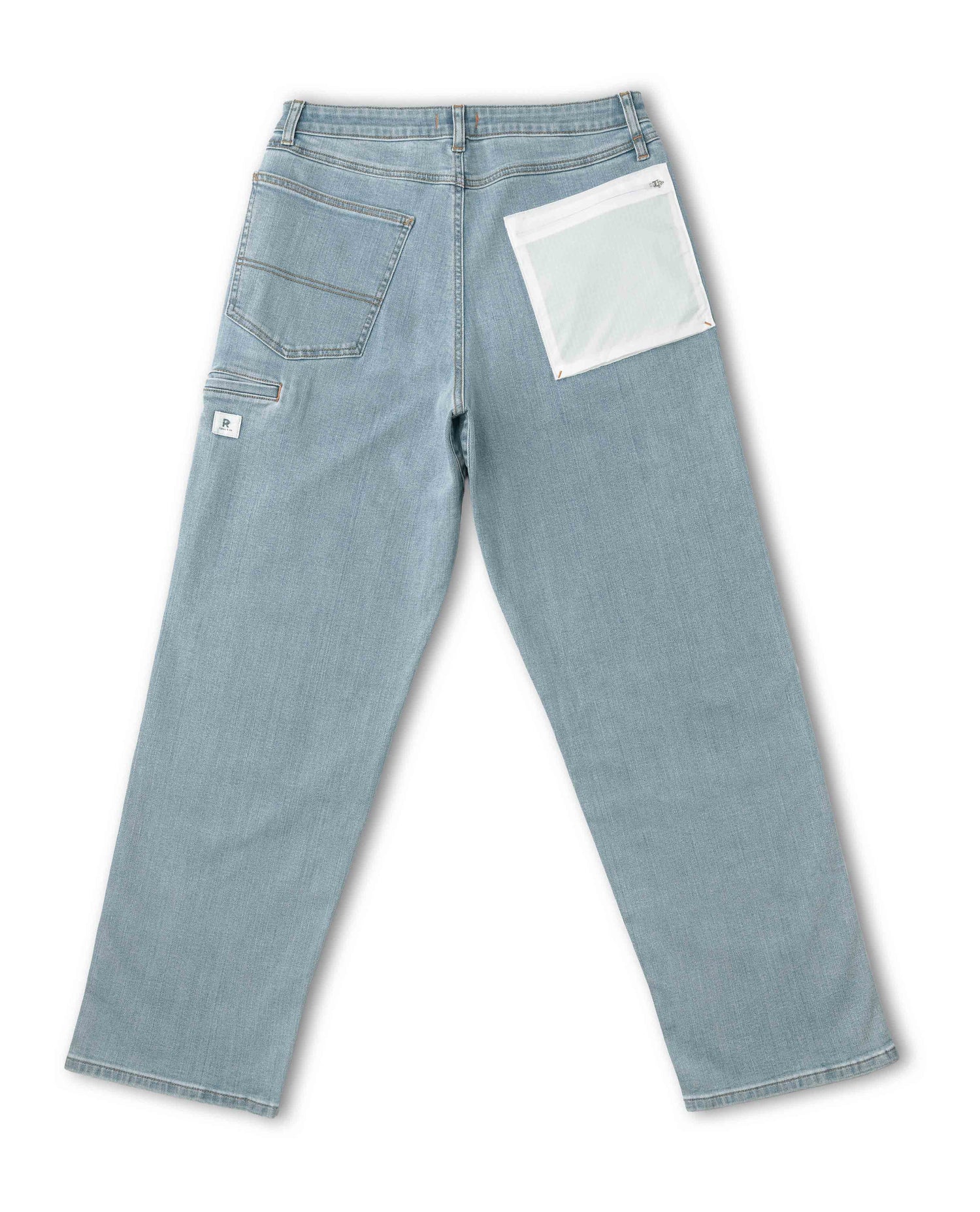 Light blue jeans with a white patch on a white background