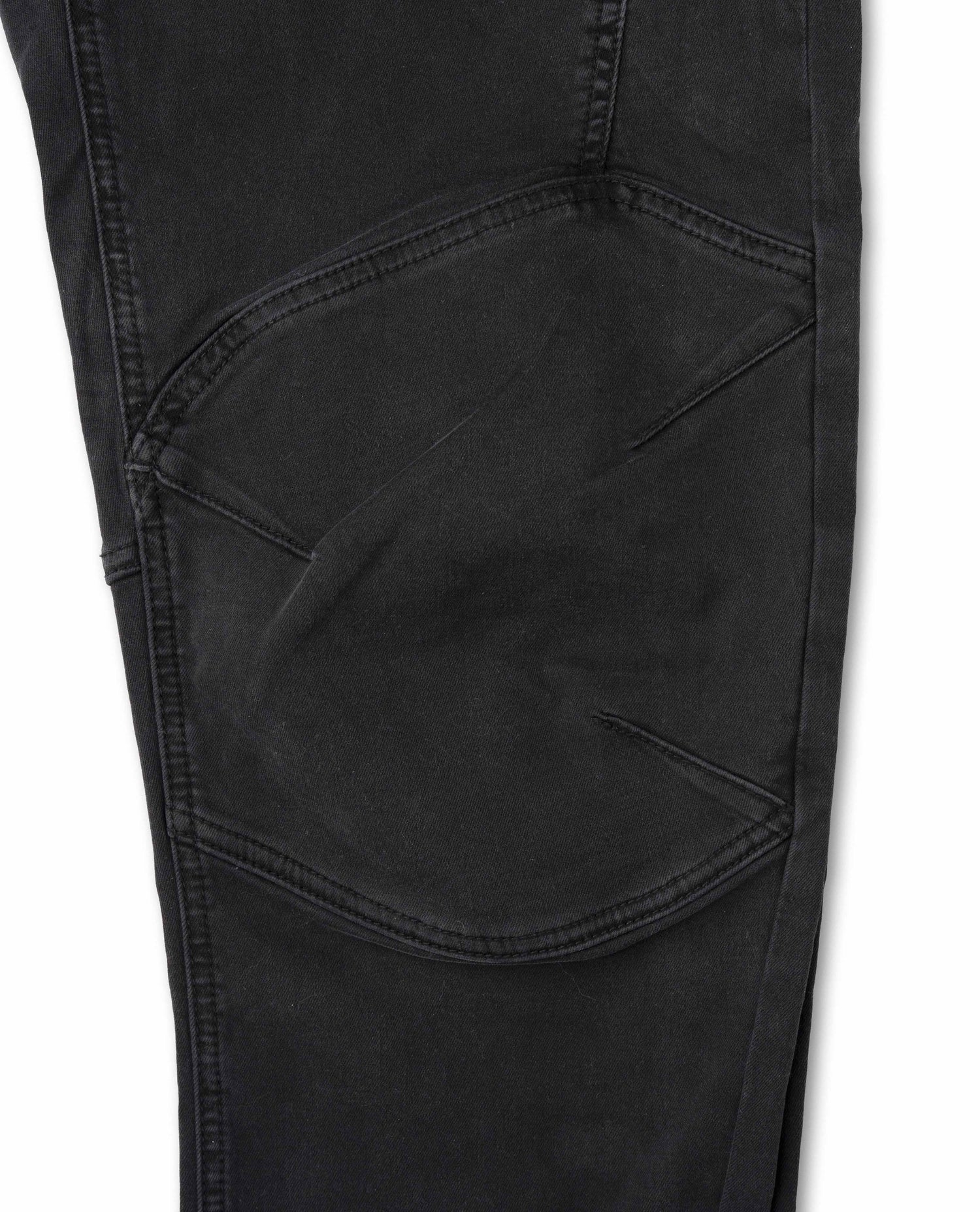 Close-up of black pants with a pocket on a white background