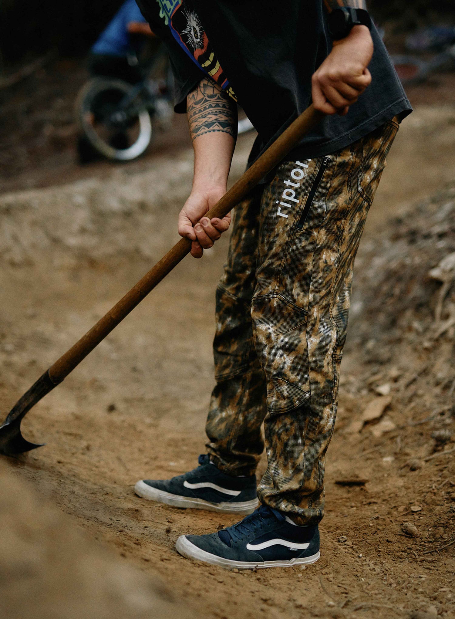 Doing some trail work in a dot camo Ripton bike pant
