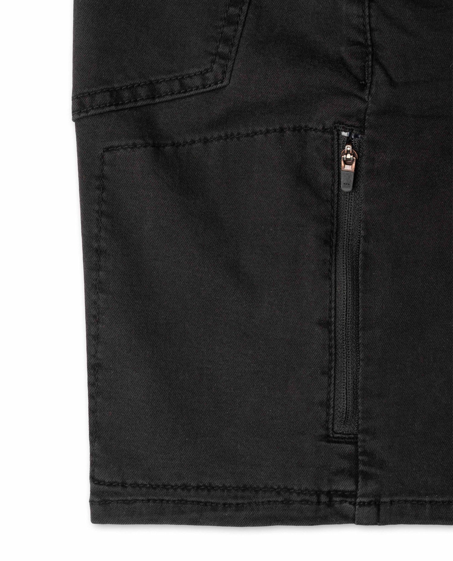 Close-up of a black pants pocket with a zipper on a white background