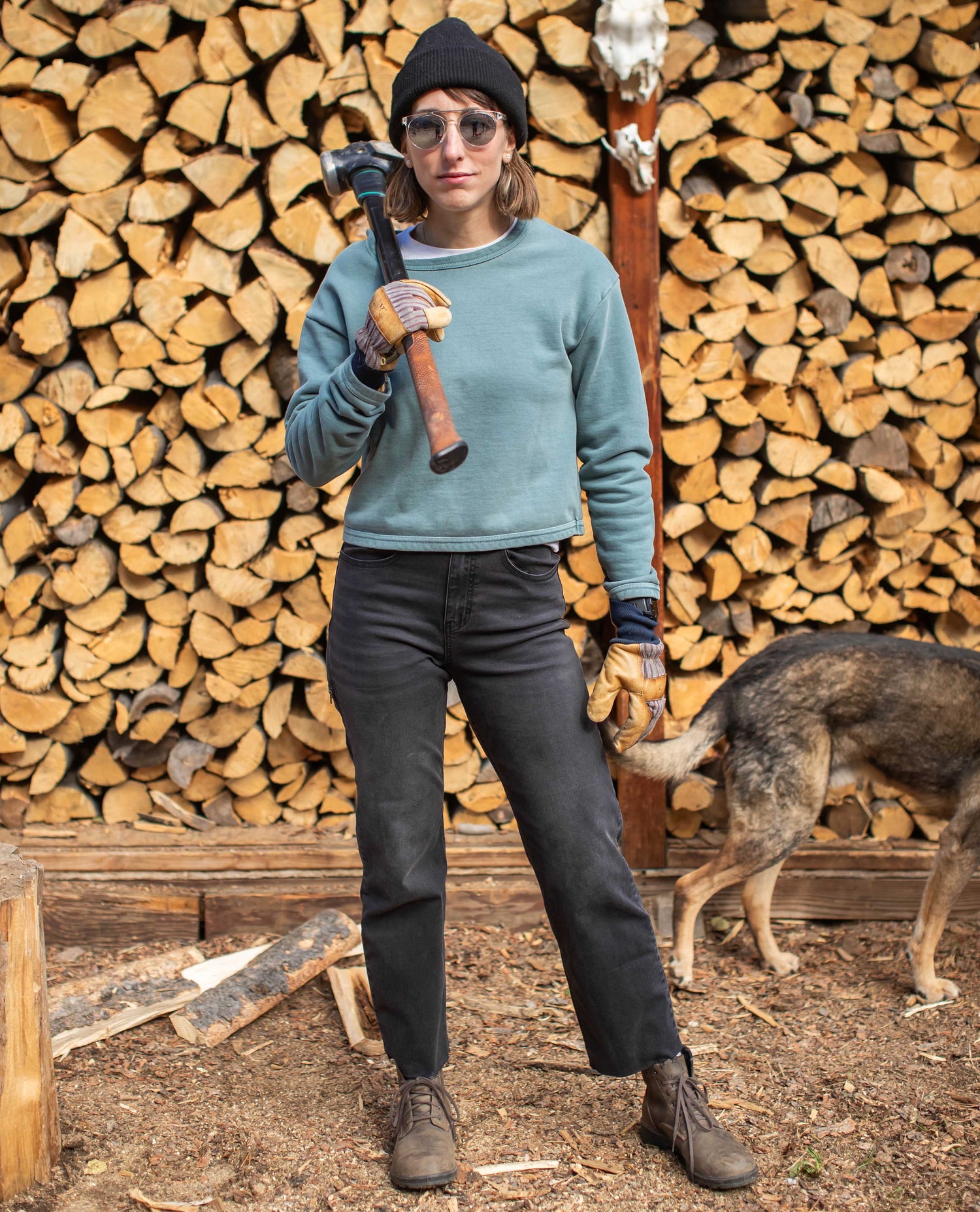 Girl chopping wood wearing Superlite Jeans