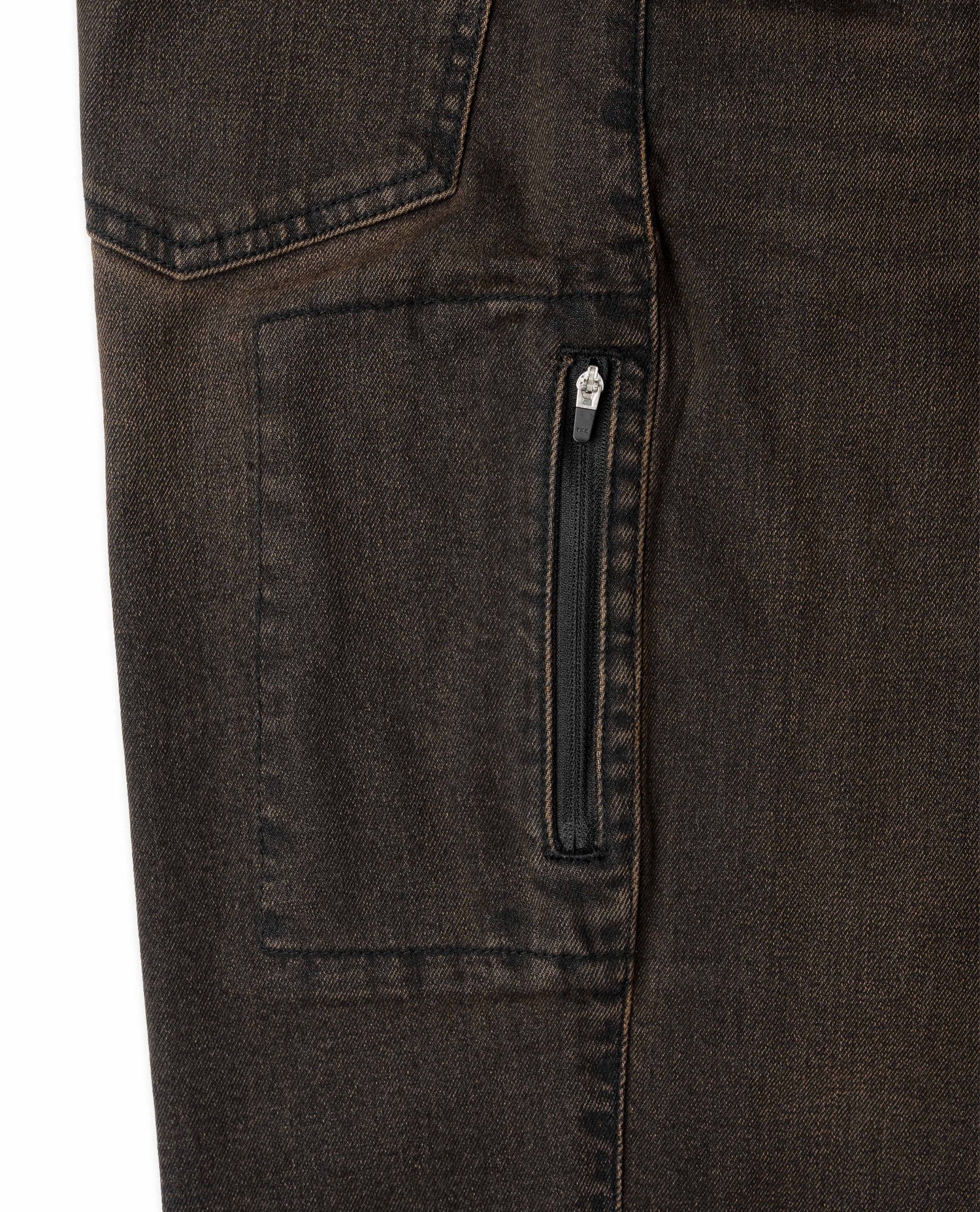 Close-up of dark brown denim pants with a zipper pocket on a white background