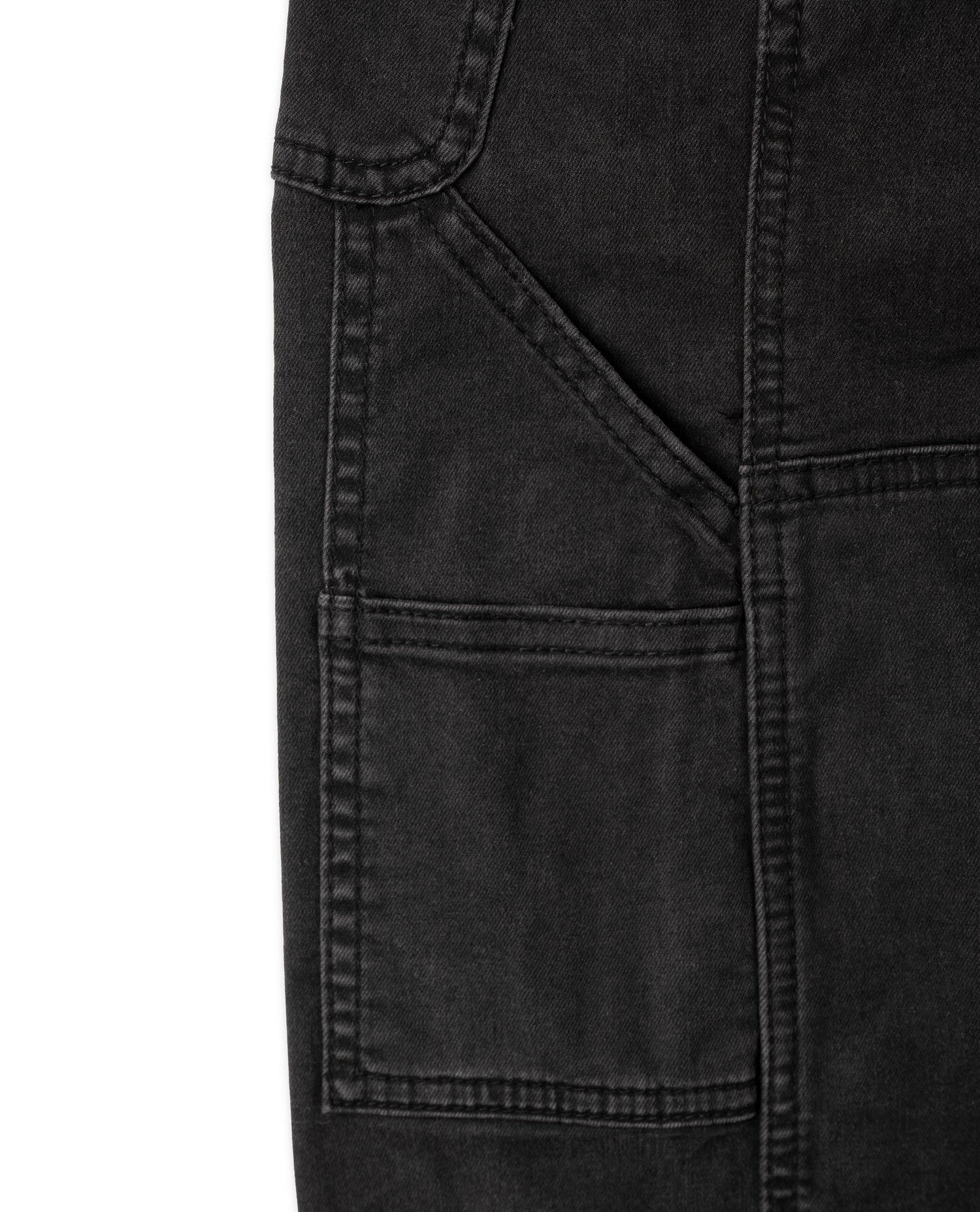 Close-up of a black denim pocket on a white background
