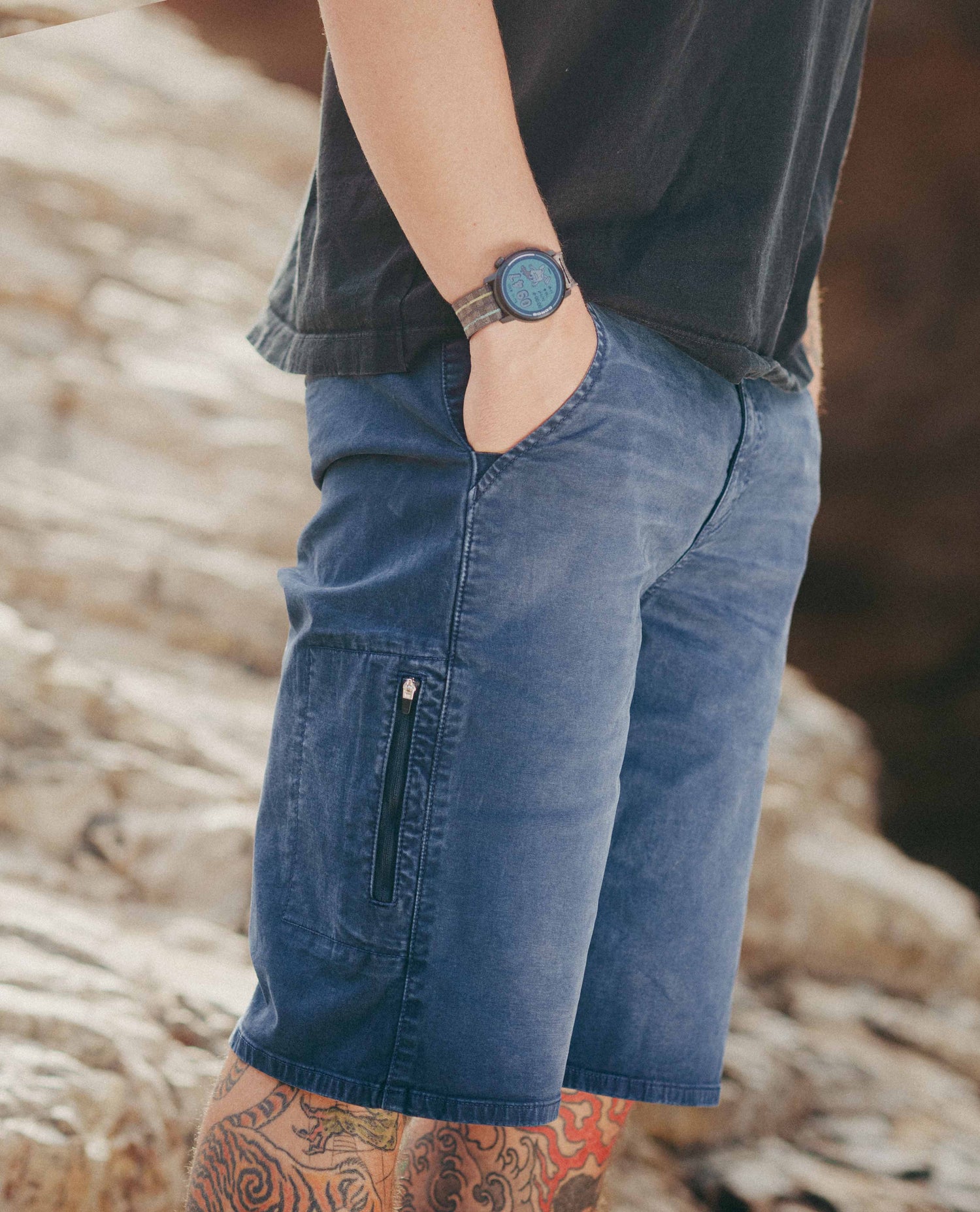 Close up of reggie shorts on a rocky beach