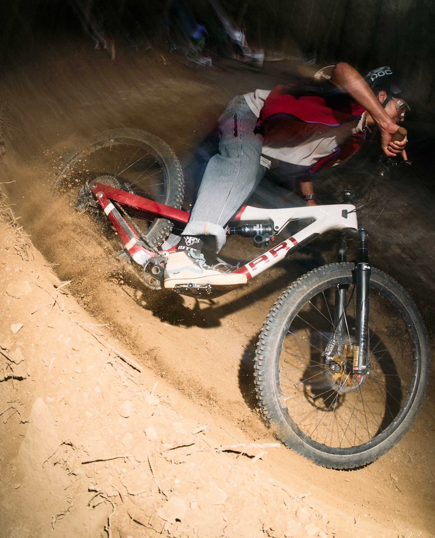 Person riding a bicycle on a dirt track