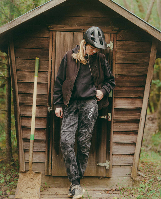 Mountain biker standing in front of a shed in hello buddy bike pants